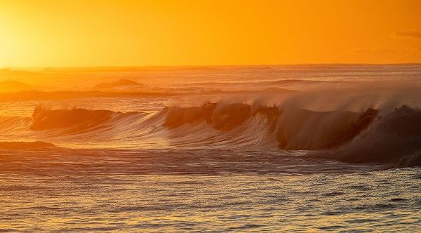 Incoming surf waves at sunrise near Poipu in Kauai-Hawaii-USA